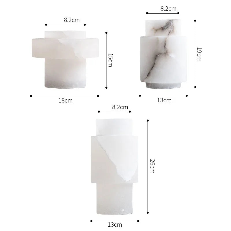 Three Scandinavian White Onyx Vases in different shapes and sizes, each with precise dimensions labeled. The vases feature a smooth, polished finish with natural white and gray veining, showcasing their elegant and modern aesthetic.