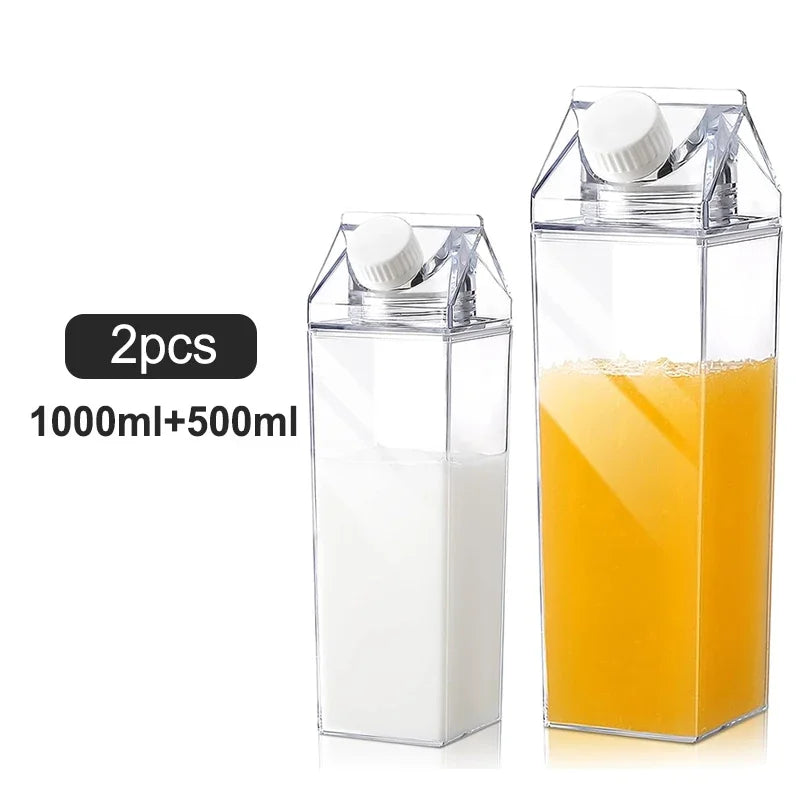 A pair of clear, carton-shaped bottles, one smaller and one larger, filled with milk and orange juice. A label indicates they are a 500ml and 1000ml set.