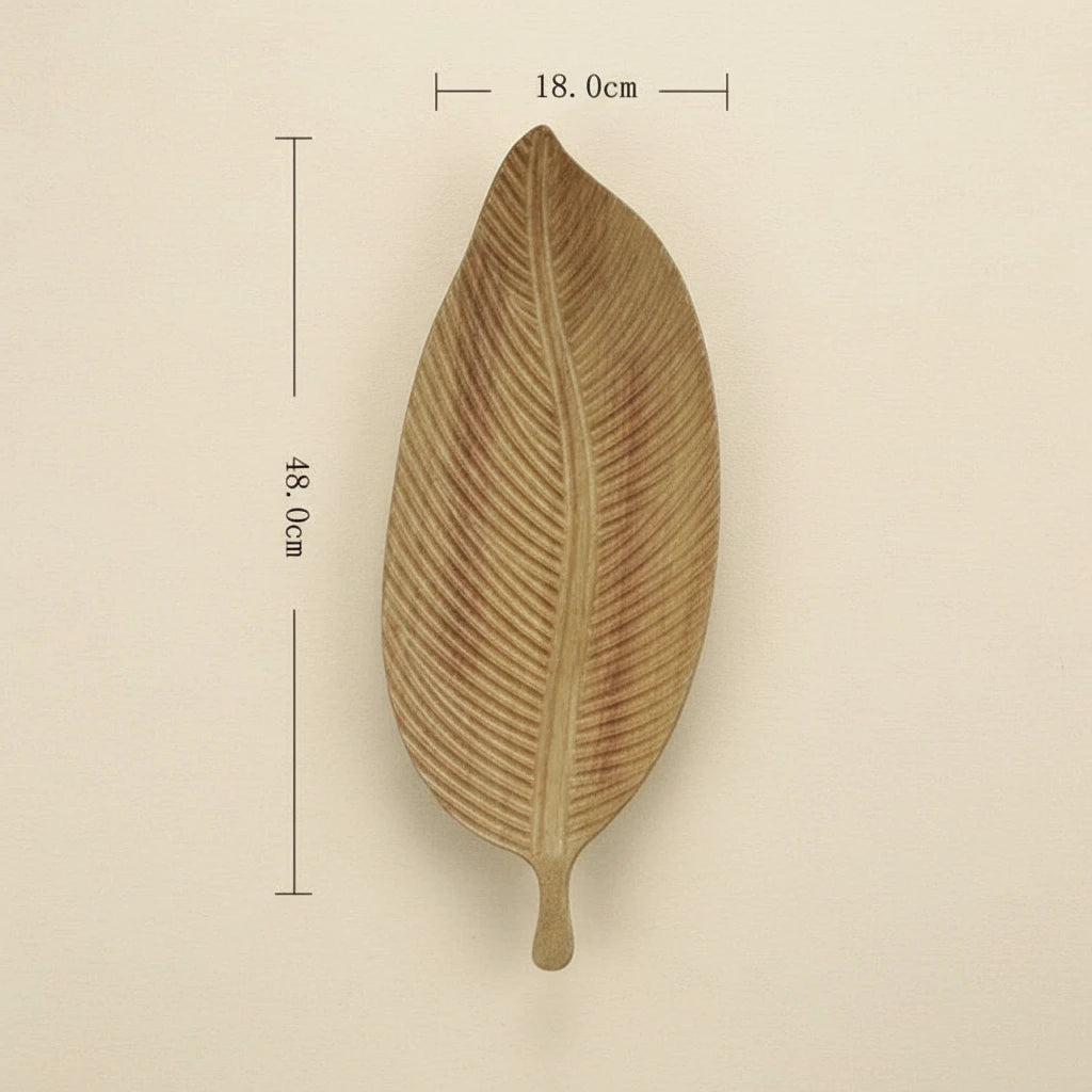 A light brown, carved wooden leaf-shaped plate is displayed against a white background, with dimensions indicating a length of 48 cm and a width of 18 cm.