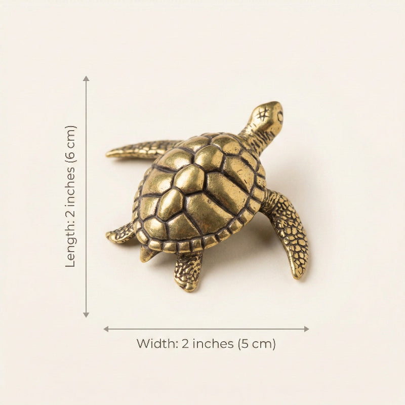 Bronze turtle figurine with measurements on a white background