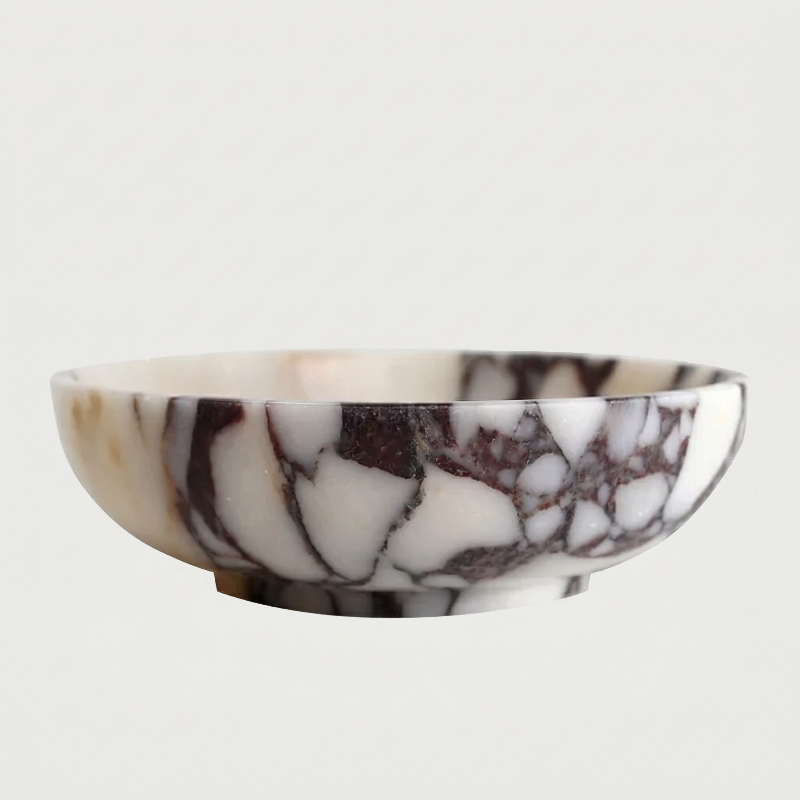 Calacatta marble bowl close-up on white background