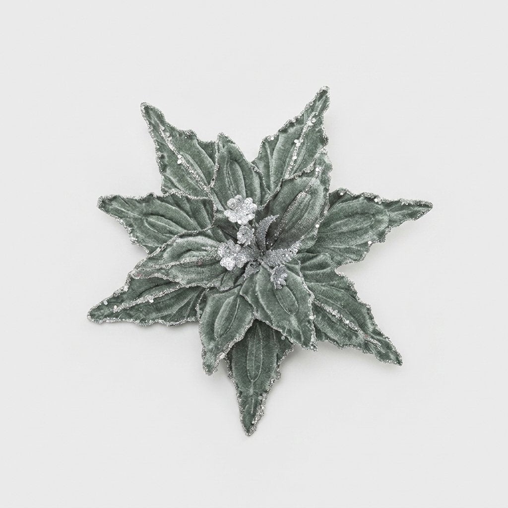 Sage green velvet poinsettia flower with silver glitter edges on a white background