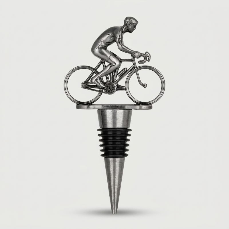 Metallic wine bottle stopper shaped like a cyclist on a bike against a white background