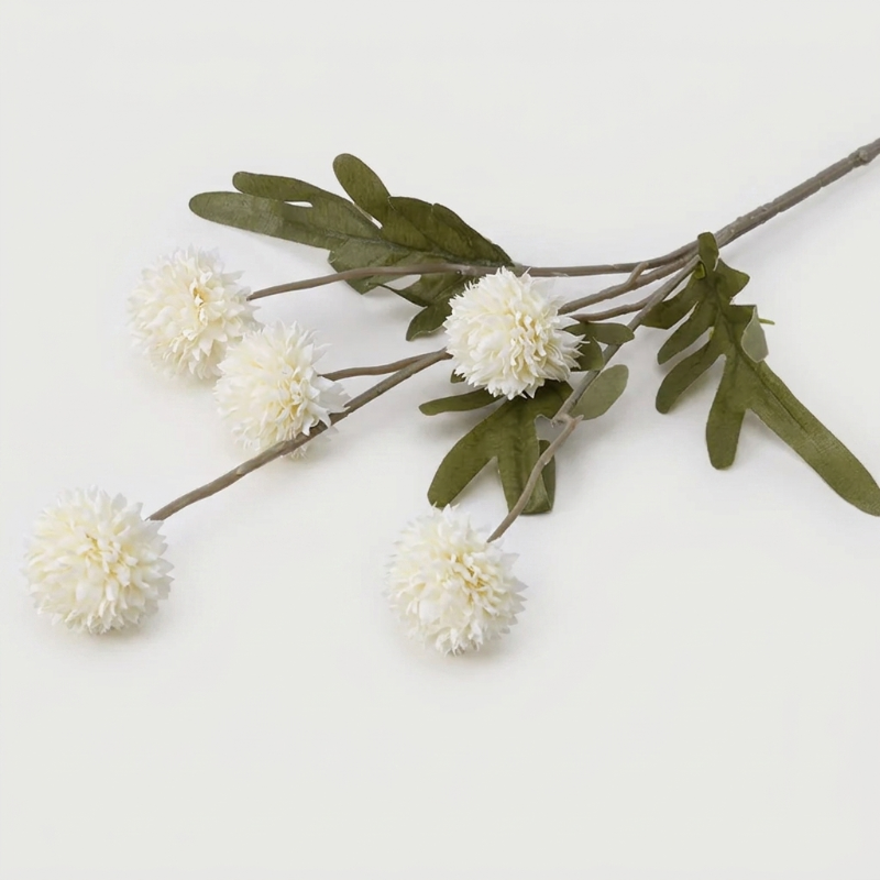 White faux dandelion stems on white background