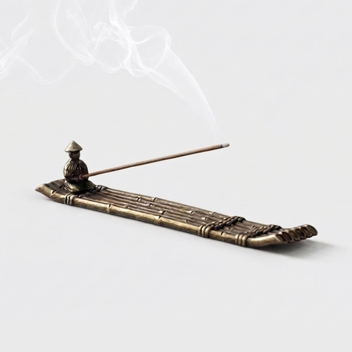 Fishing boat incense burner on white background with smoke