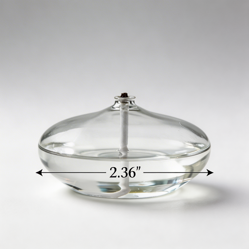 Glass oil candle on white background from side angle