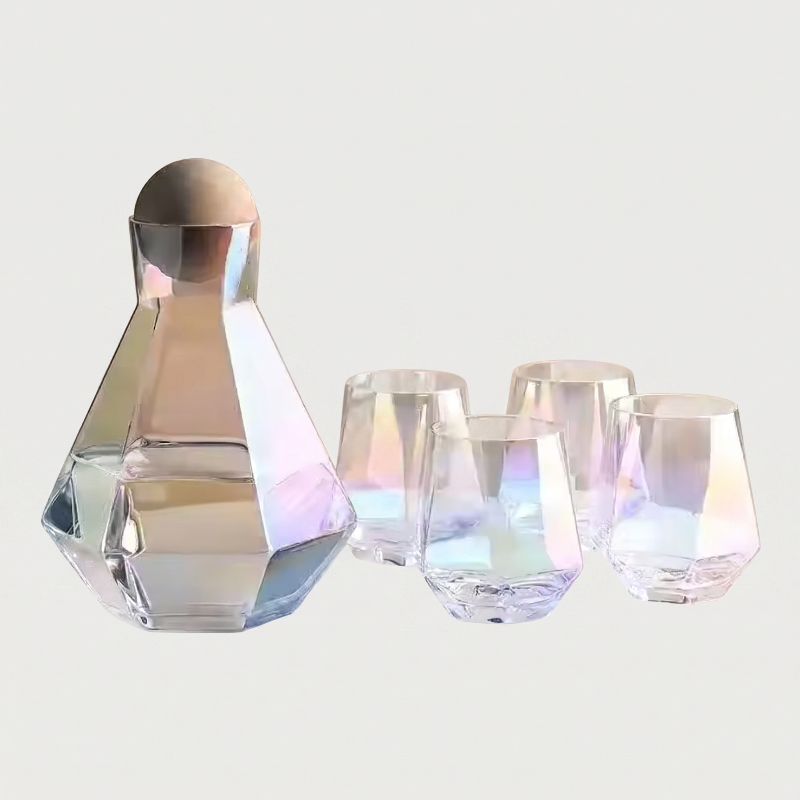 Set of iridescent glassware including a carafe and four glasses on a light gray background