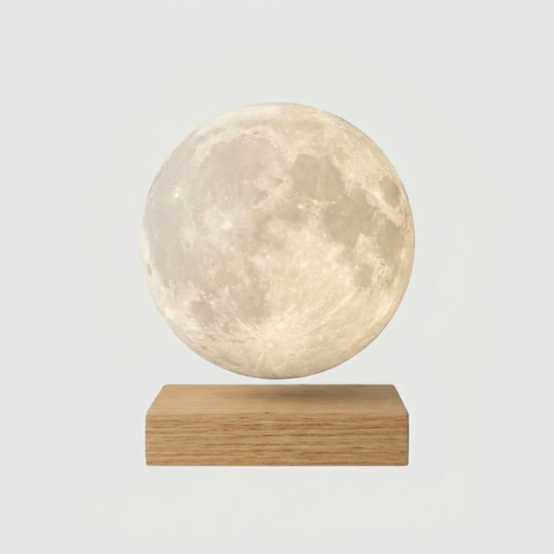 Luna floating moon lamp on light wood base on white background