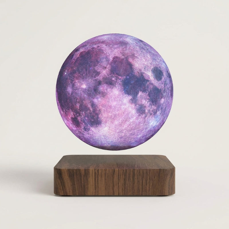 Purple moon-shaped lamp on a wooden base against a light gray background