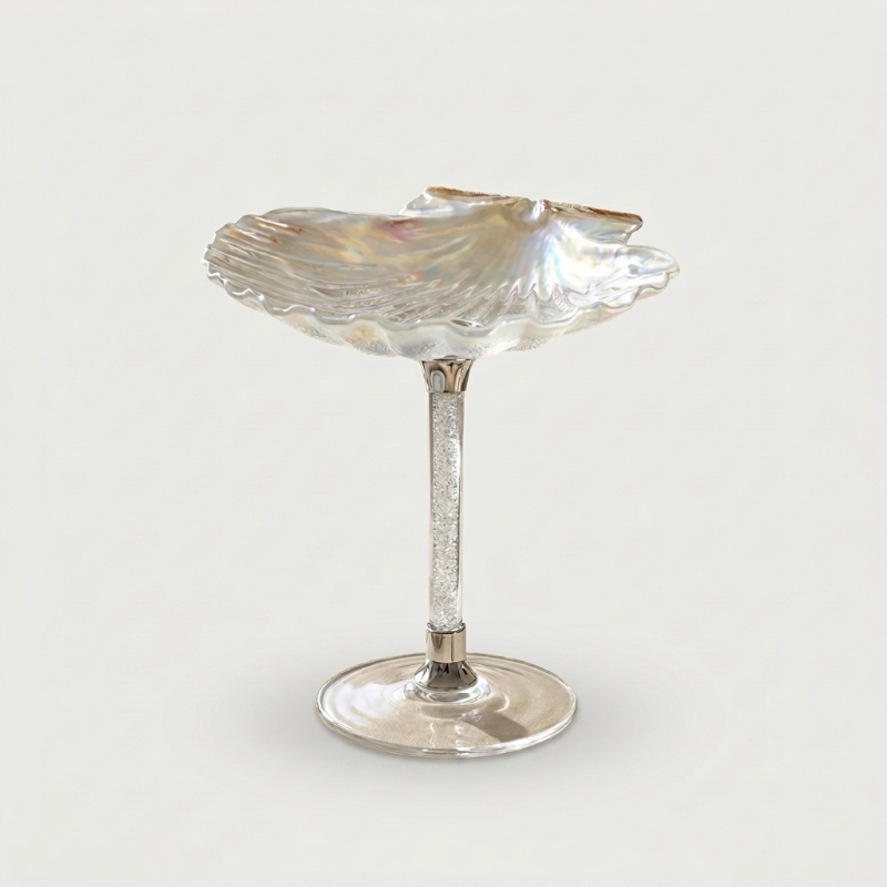 Cream Maris seashell glass on white background