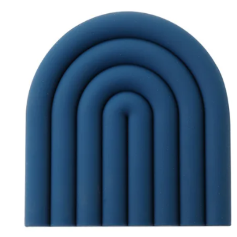 A teal blue silicone trivet or coaster with a modern, segmented rainbow arch design is shown against a white background. The trivet has five raised, semi-circular segments.