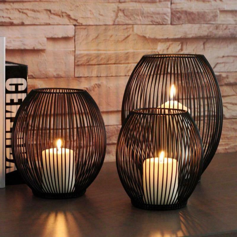 Elegant iron candle holder with a sleek design, perfect for adding warmth and sophistication to any space.