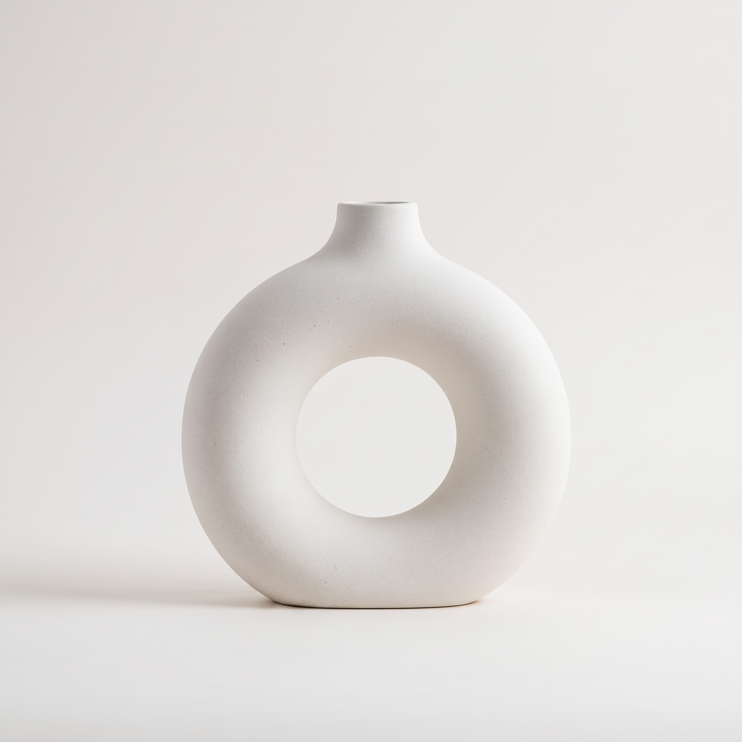 White Sculptural Ring Ceramic Vase hero shot on a clean off-white studio background