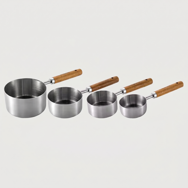 Silver measuring spoons set of 4 on white background