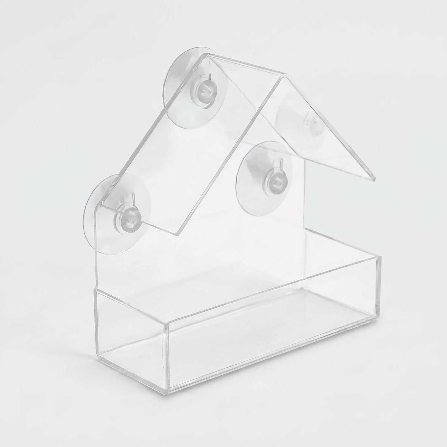 Clear acrylic suction cup window bird feeder in a house shape, for hanging on windows