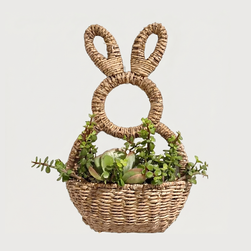 Woven bunny wall basket on white background with greenery