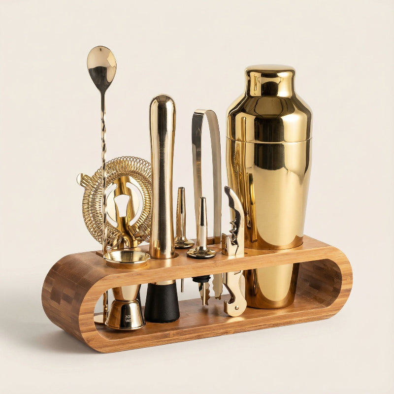 Gold 10-piece cocktail bar set with stainless steel tools displayed on a countertop.