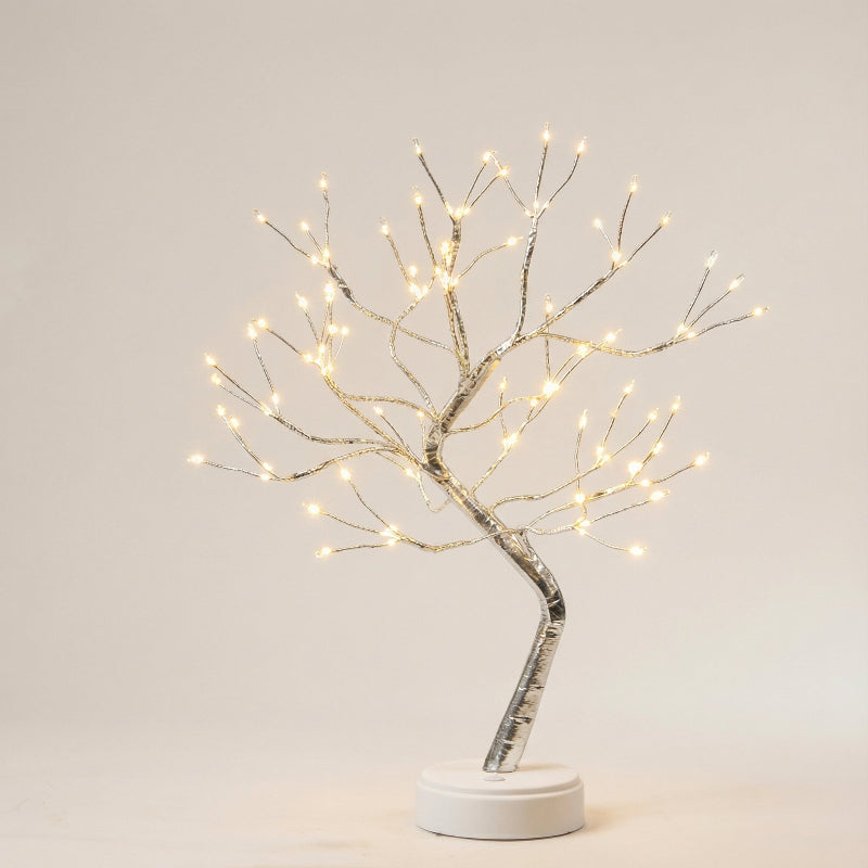 Decorative tree with lights on a plain background