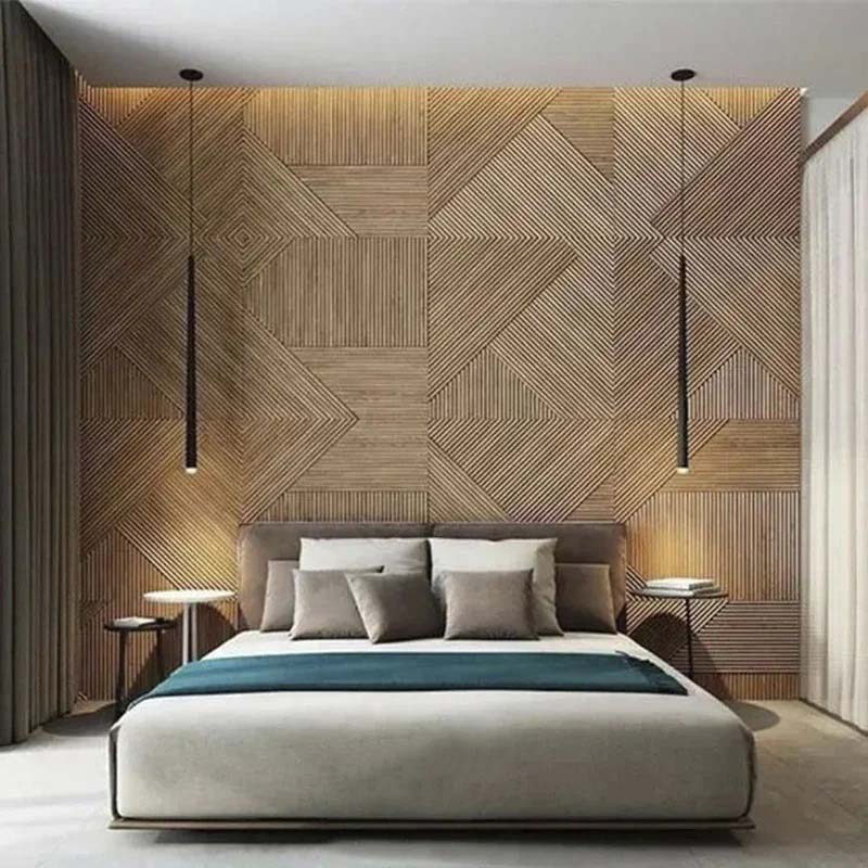 Modern bedroom with geometric wood-paneled wall, large bed, and teal accents.