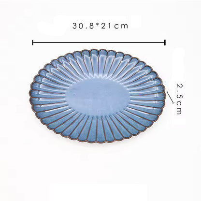 A blue oval ceramic platter with its dimensions labeled as 30.8 x 21 cm and 2.5 cm high.
