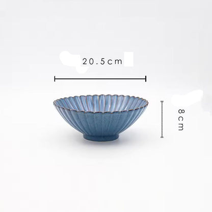 A blue ceramic serving bowl with its dimensions labeled as 20.5 cm wide and 8 cm high.