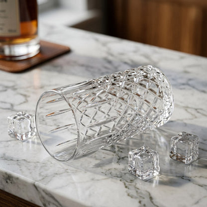 11oz highball glass filled with ice cubes on a marble countertop