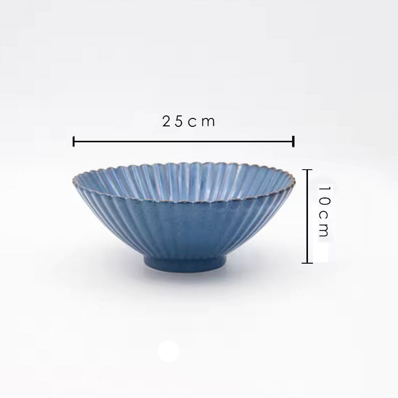 A blue ceramic serving bowl with its dimensions labeled as 25 cm wide and 10 cm high.