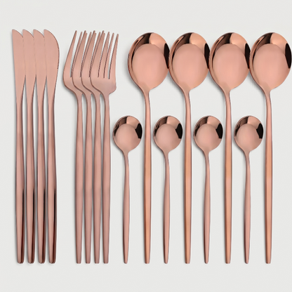 Rose gold stainless steel 16-piece cutlery set with white background.