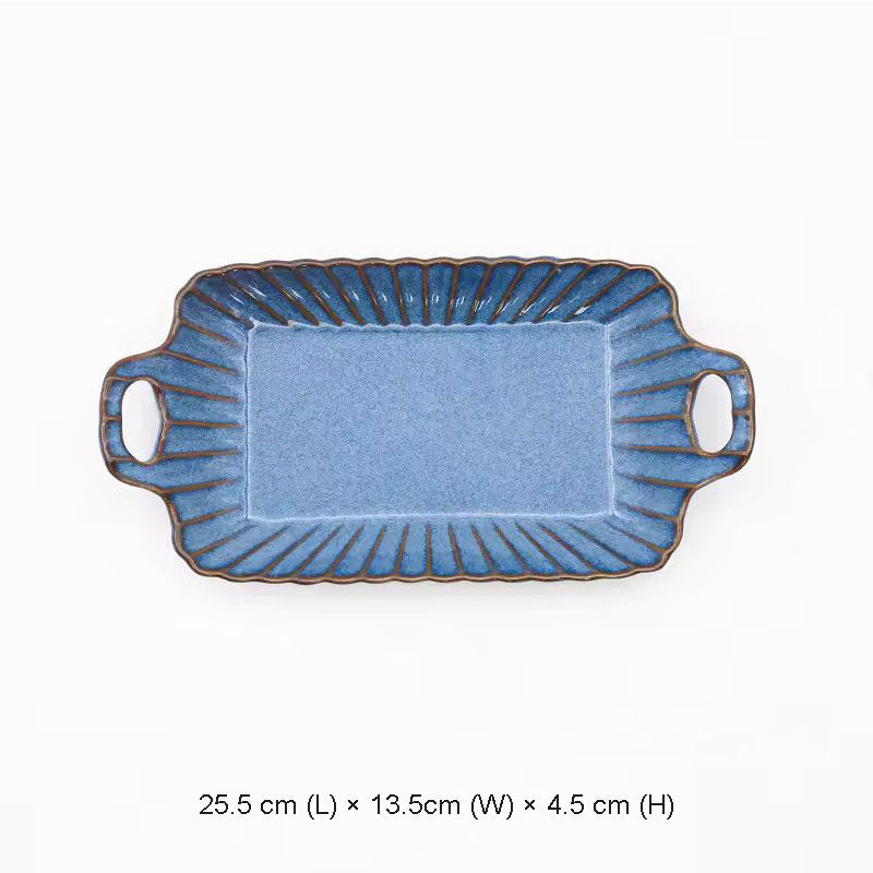 A rectangular blue ceramic serving tray with handles.