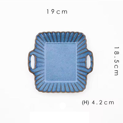 A square blue ceramic serving dish with handles.
