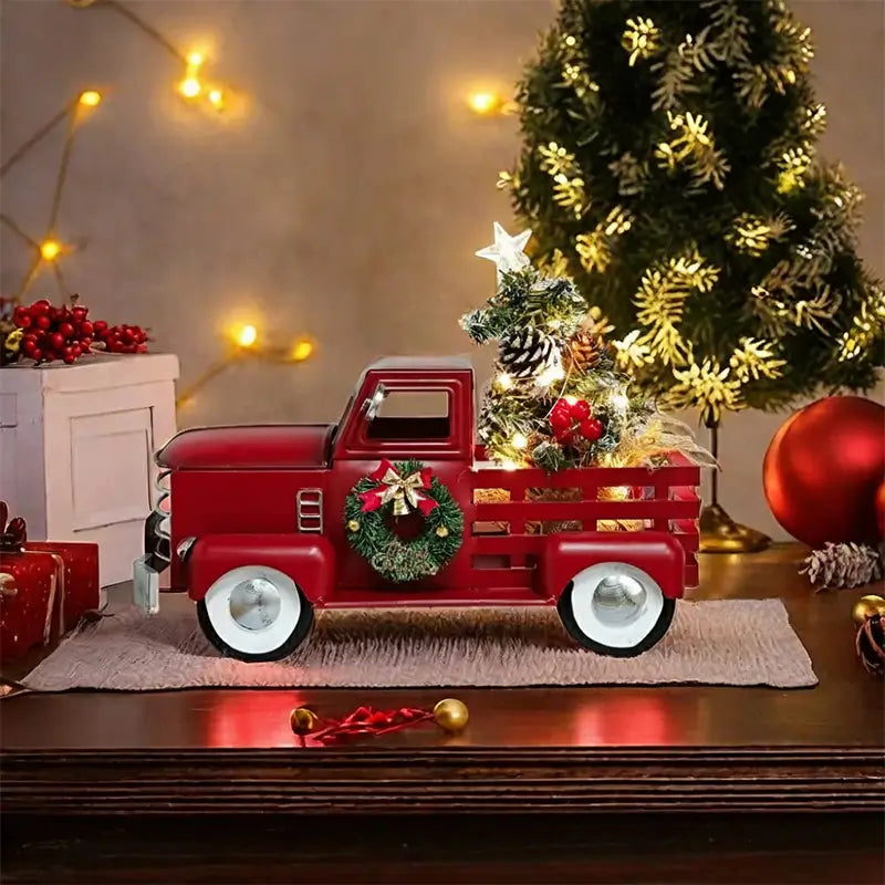 Red truck Christmas decoration on a table.