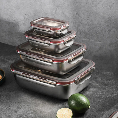 A stack of four rectangular stainless steel food containers with red-trimmed clear lids.