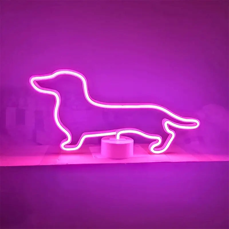 A bright neon sign shaped like a dachshund dog, glowing pink, sitting on a white circular base.