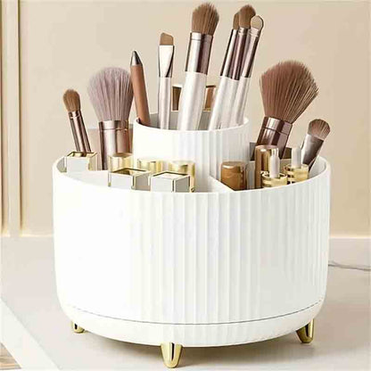 A white, round makeup organizer with various brushes and cosmetic products on a light background.