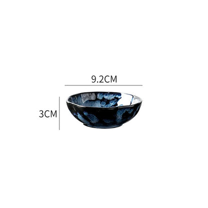 A small, round ceramic dipping bowl with a dark blue and white textured pattern, showing its dimensions: 9.2cm in diameter and 3cm in height.