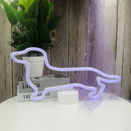 A subtle neon sign shaped like a dachshund dog, glowing a pale lavender or white, resting on a stack of books.