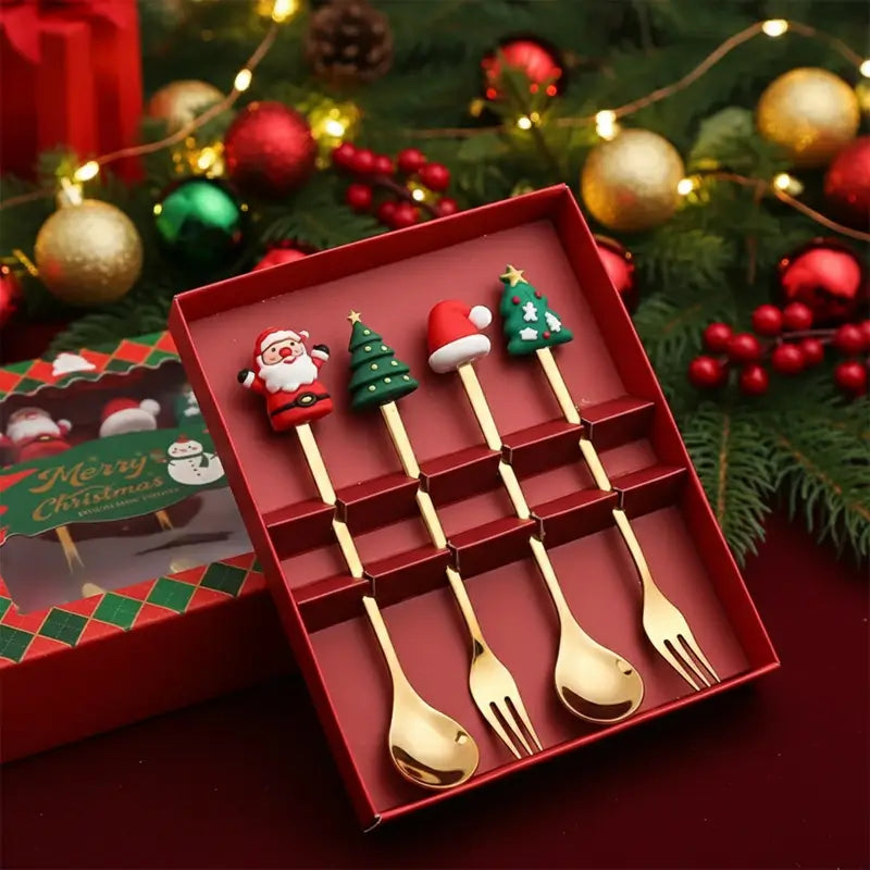 Four decorative Christmas spoons and forks in a gift box.