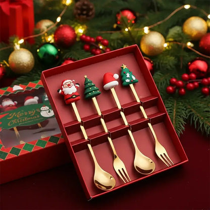Four decorative Christmas spoons and forks in a gift box.