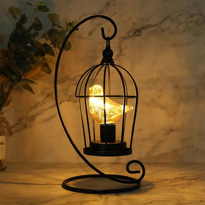Decorative lamp with a birdcage design on a marble surface