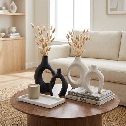 Black and white sculptural ceramic vases styled together in a living room, Kiyo Home