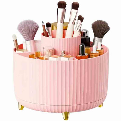 A pink, round makeup organizer with various brushes and cosmetic products.