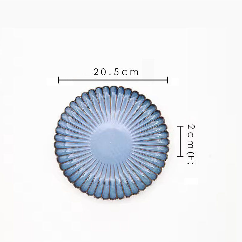 A blue ceramic plate with its dimensions labeled as 20.5 cm wide and 2 cm high.