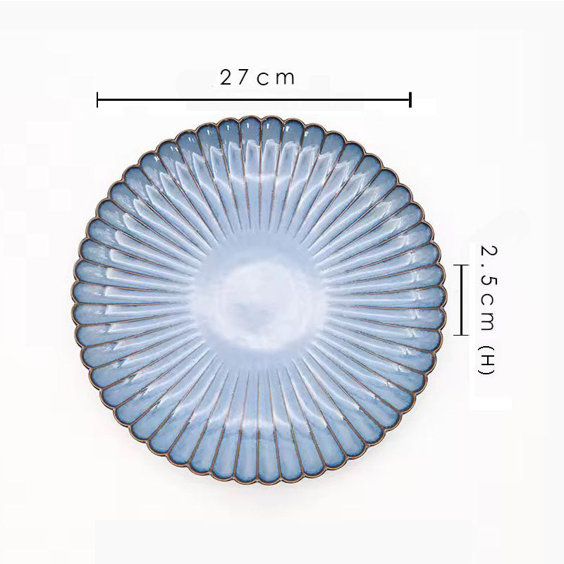 A blue ceramic plate with its dimensions labeled as 27 cm wide and 2.5 cm high.