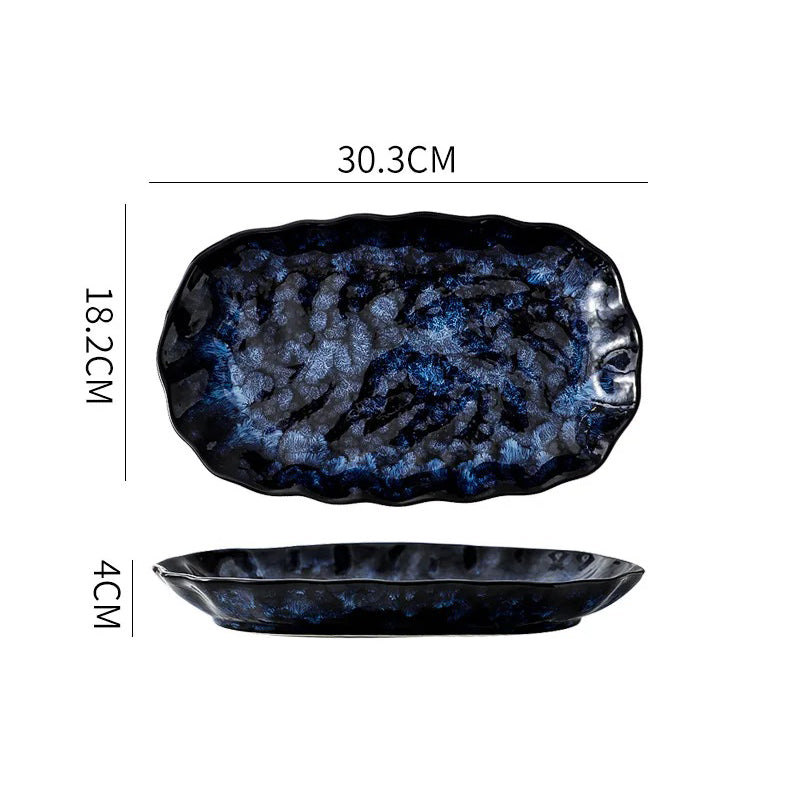 A dark blue and white textured ceramic rectangular dish with rounded, wavy edges, showing its dimensions: 30.3cm long, 18.2cm wide, and 4cm high.
