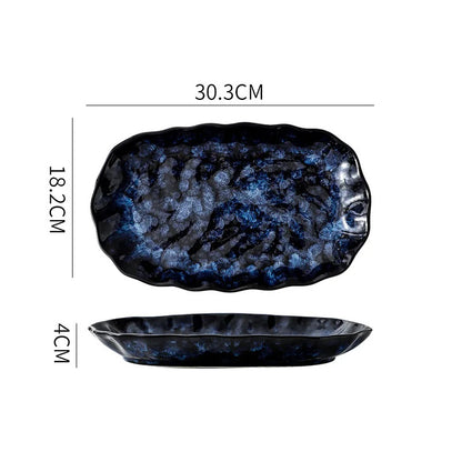 A dark blue and white textured ceramic rectangular dish with rounded, wavy edges, showing its dimensions: 30.3cm long, 18.2cm wide, and 4cm high.