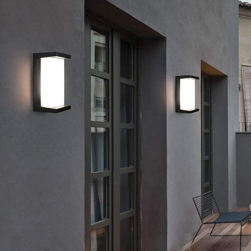 Multiple Arya Motion Sensor Lights installed at regular intervals, ensuring even illumination and increased security across an outdoor space. These lights offer the perfect balance of style and functionality with their sleek black finish and advanced sensor technology.