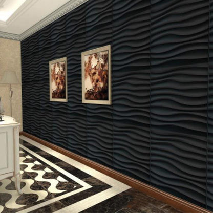 A hallway with a dark wavy textured accent wall, two framed pictures, a white console table, and a black and white patterned floor.