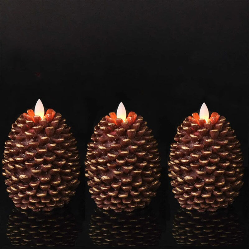 three LED candles shaped like pinecones on a dark background.