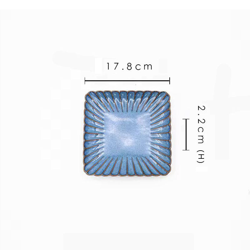 A blue square ceramic plate with its dimensions labeled as 17.8 cm wide and 2.2 cm high.