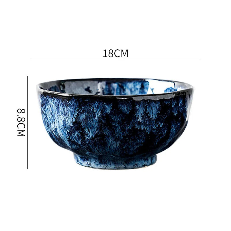 A round ceramic bowl with a dark blue and white textured pattern, showing its dimensions: 18cm in diameter and 8.8cm in height.
